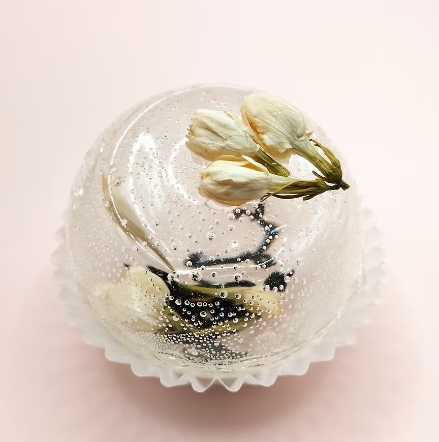 Clear tea sphere with jasmine flowers