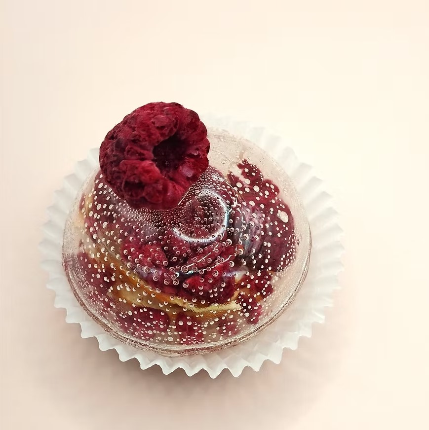 Tea sphere with a whole dried raspberry on top